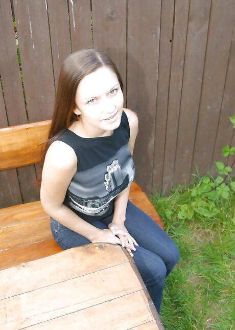 Excellent brunette teen Lucie exhibiting big hooters and spreading her legs outside