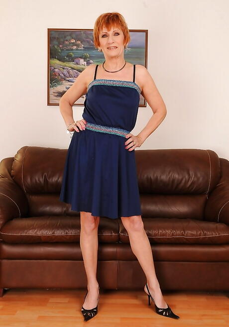 Very attractive mature Mabel in skirt exposes small tits and spreads her legs 